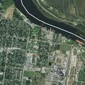 Person experiencing arm pain near Main Street in Port Neches