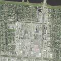Man aged 57 in pain lying on ground at 18th St