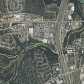 Search for wanted assault suspect near motel