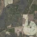 Person pointing laser at aircraft near church
