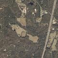 Wildfire destroys one structure, threatens two more