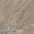 Car hits light pole and leaves debris on AZ-90