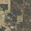 Person tampering with front door at rural home