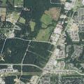 Vehicle wreck causing oil spill on roadway