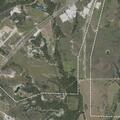 Grass fire burning in field on Rana Drive