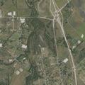 Woman experiencing abdominal pain near Whispering Meadows Road