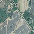 Grass fire spreading toward solar panels