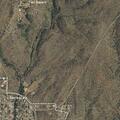 Man walking in road on highway 152 near apartments
