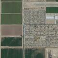 Man lying on sidewalk at Joshua Tree and Smokewood