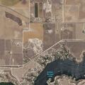 Male lying next to car with aggressive dog at Buffalo Springs
