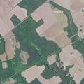 Cotton field fire spreads toward building