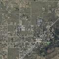 Child locked in white hatchback at fuel station
