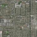 Person experiencing back pain near West Ninth Street in Upland