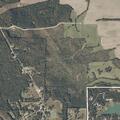 Woods fire near structures on County Road 200