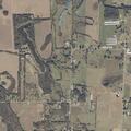 Suspicious vehicle driving on grass near residence