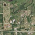 Man suffering severe back spasms at rural address