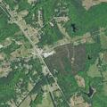 Truck crash in ditch near auto sales lot