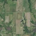 Grass fire with buildings fully engulfed at farm