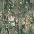 Brush fire smoldering near campground and pond