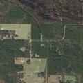 Grass fire threatening structure on Rich Mountain Road