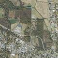 Bullet reported striking a house; vehicle windows reported broken