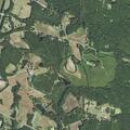 Suspicious SUV in vacant field near residence