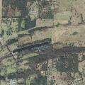 Field fire from rekindled burn pile near home