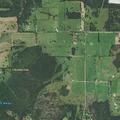 Helicopter spraying yards with possible fertilizer