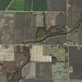 Grass fire spreading toward barn on State Highway 14
