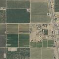 Grass fire near structures on Road 126 in Pixley