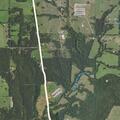 Trash fire spreads near county line property