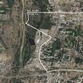 Person lying outside gate with dogs near Riverside