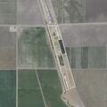 Two suspects cut hole in business fence