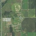 Grass fire at chicken farm threatens structure
