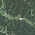 Vehicle crashes through fence into field near Galena