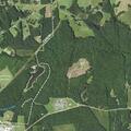 Woman chased by dog near reservoir trail
