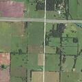 Brush and cornfield fire spreads near rural homes
