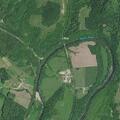 Woman found lying near river by water plant