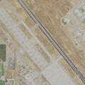 Vegetation fire burning grass near Castle Airport
