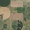Broken combine blocks roadway at rural intersection