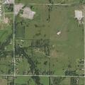 Brush fire near house spreads toward west field
