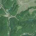 Man injured after golf cart overturns into creek
