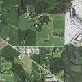 Elderly male driver off road at Monroe County Co-op lot