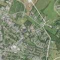 Person experiencing back pain near Vine Street in Harrisonburg