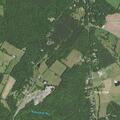 Controlled barn fire near wood line at farm