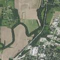Tanker dumping liquid into roadside ditch