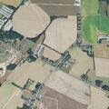 Two-car crash knocks down light pole at traffic circle