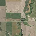 Small hay burn piles in field near Hoisington