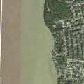 Cars parked on grass at Riverside Drive park