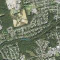 Woman knocking on doors at Glenmont Apartments